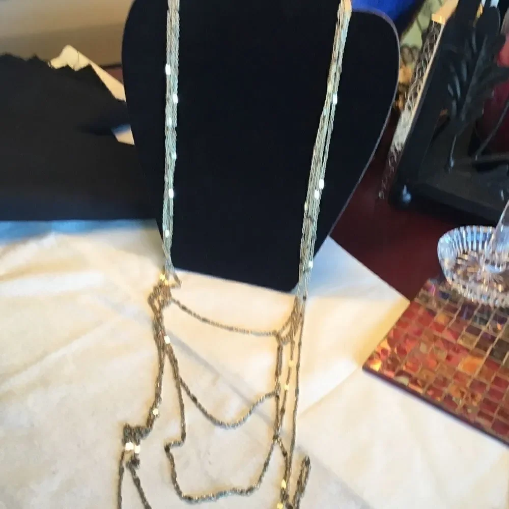 $12 or 3/$25. 5 Strand Goldtone Necklace